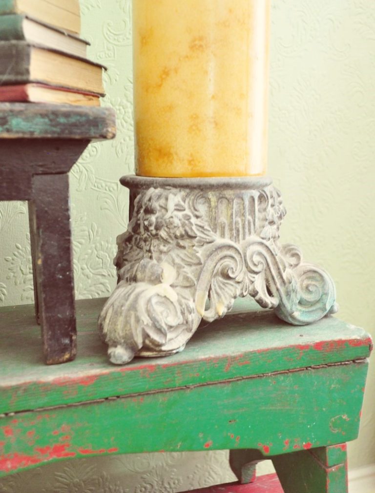 Large, fancy, lamp base, bought at a yard sale for a dollar, now used as a candle stand. Never pass up a pretty lamp base!