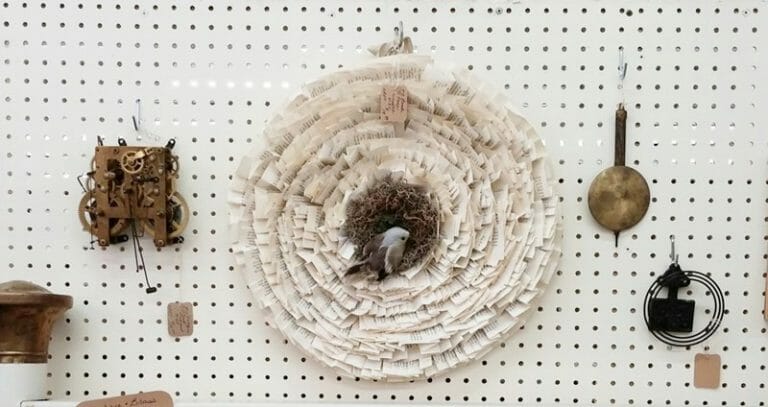 Book page wreath and clock parts as wall decor