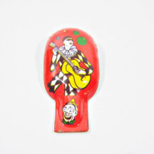 Vintage tin clicker with Harlequin lithograph, made by US Metal Toy Mfg