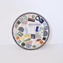 5-1/4" round, mosaic tile trivet set in a tin base.