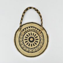 Boho straw purse used as wall hanging