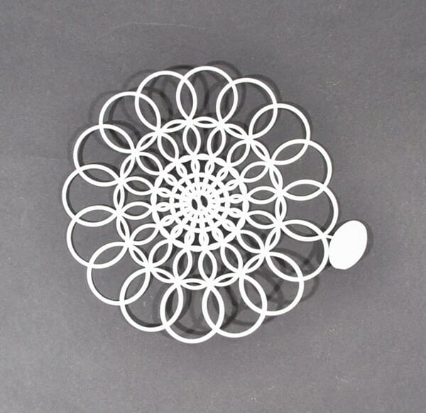 6" Tupperware doily with tab attached