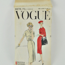 Vogue 8878. A wiggle dress pattern dated 1957. Buttons up front from hip, has short or 3/4 length sleeves and Peter Pan style collar.