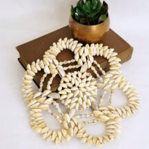 Vintage cowrie shell trivet. Beach decor