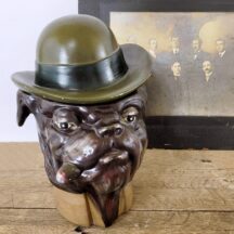 Vintage cigar humidor. A bulldog wearing a hat smoking a cigar. A cigar jar by Xonex with certificate of authentication