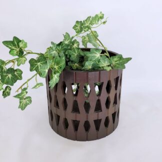 Vintage 1960s wood flowerpot holder with geometric cutouts. Made in Japan