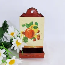 Vintage match safe with red and golden apples and cherries decoration.