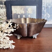Vintage brass planter. 8" square with scalloped sides and ornate feet.