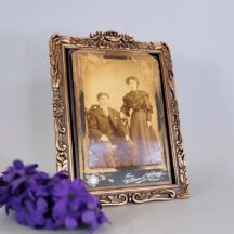Ornate picture frame, bronze colored metal, for a 5x7 photo.