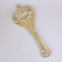 Large brass Egyptian bottle opener with hieroglyphics design
