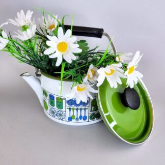 Vintage mod enamel teapot used as a planter