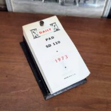 1973 daily calendar on iron stand. Unused.