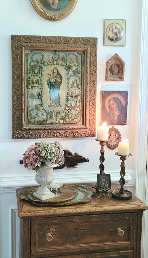 Vintage vignette on a small wall in our foyer. Foyer decor.